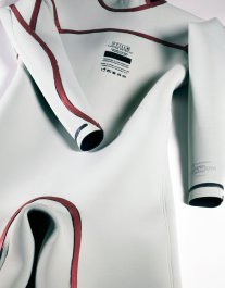 The inside of the suit shows the taped seams and the custom nameplate