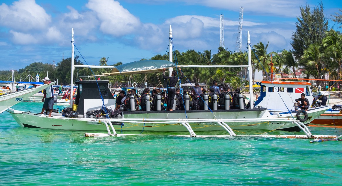 Boracay, Philippines - February 25, 2016: Divers at diving boat