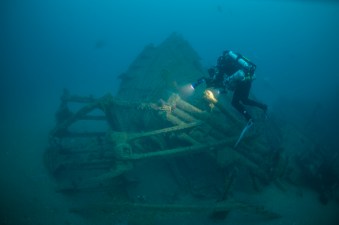 A NOAA diver inspects and documents the steering quadrant. Photo: Joe Hoyt, NOAA