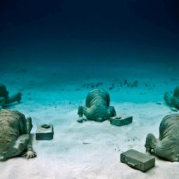 The Bankers sculpture by Jason deCaires Taylor Cancun Underwater Museum