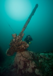 The deck gun of U-85 silently points towards the surface as if waiting on a target. (Photo: Brett Seymour, NPS/NOAA)